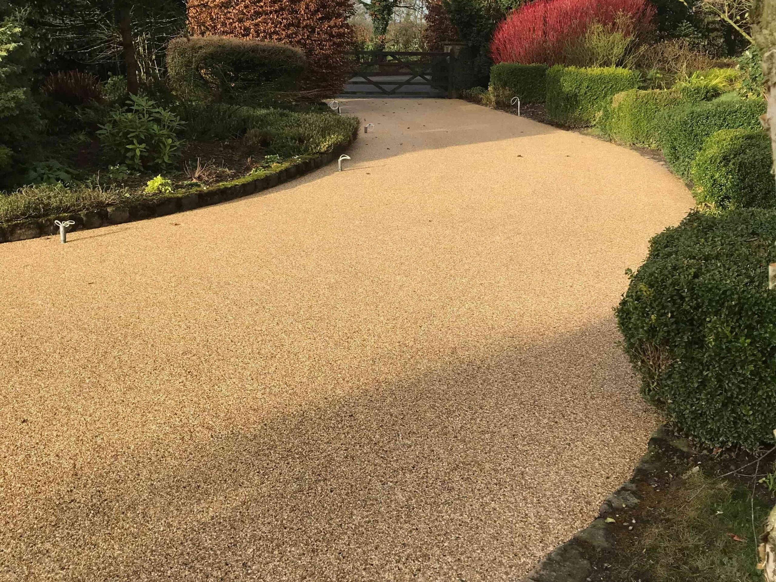Curved resin-bound driveway in Goosnargh, Lancashire with a decorative stone finish
